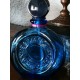 Flacon de parfum bleu de marque Rochas-Paris